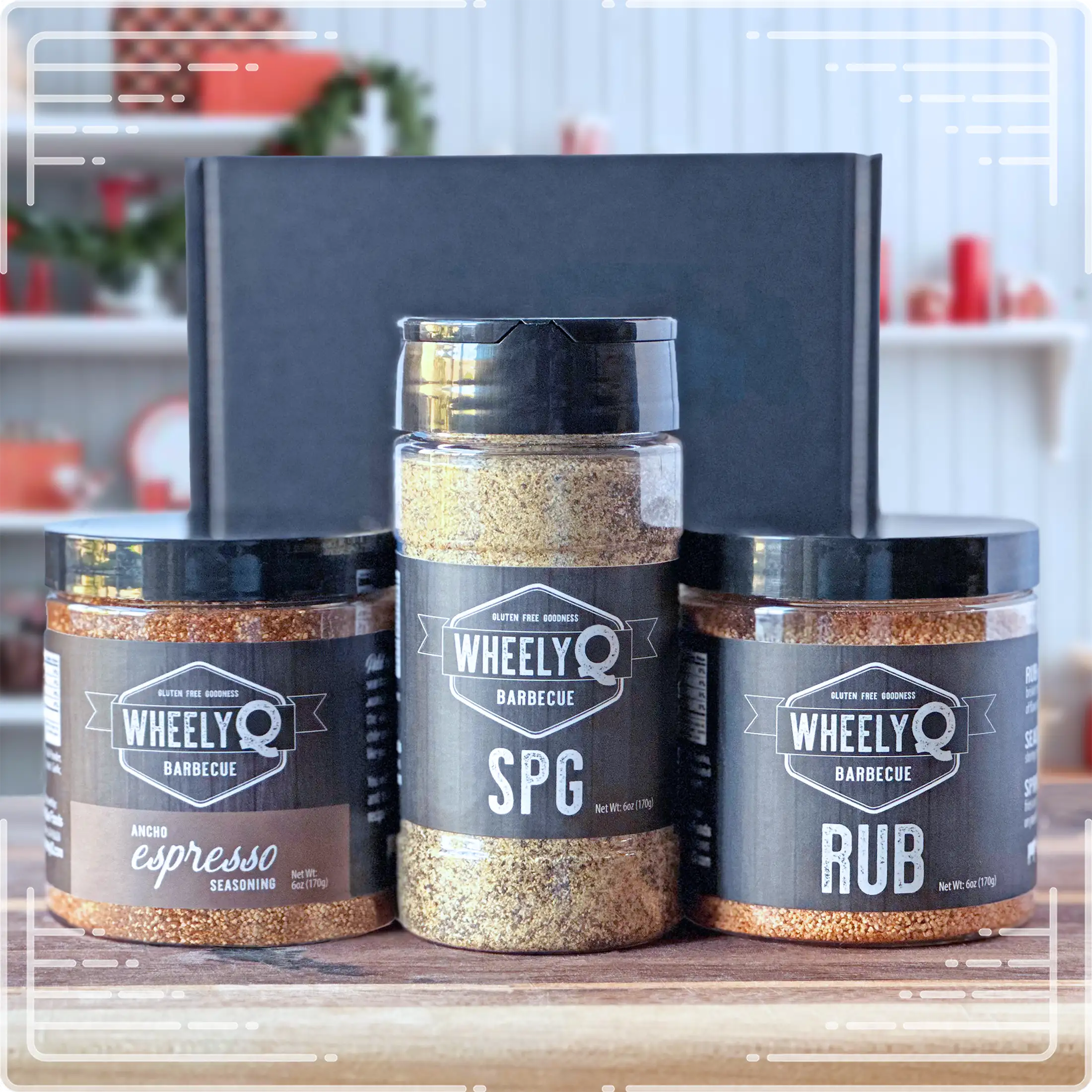 Image of our Rub and Seasoning Gift Box from WheelyQ Barbecue.  This gift set includes 1 jar of Ancho Espresso Seasoning, 1 bottle of SPG Seasoning and 1 jar of All-Purpose Rub.
