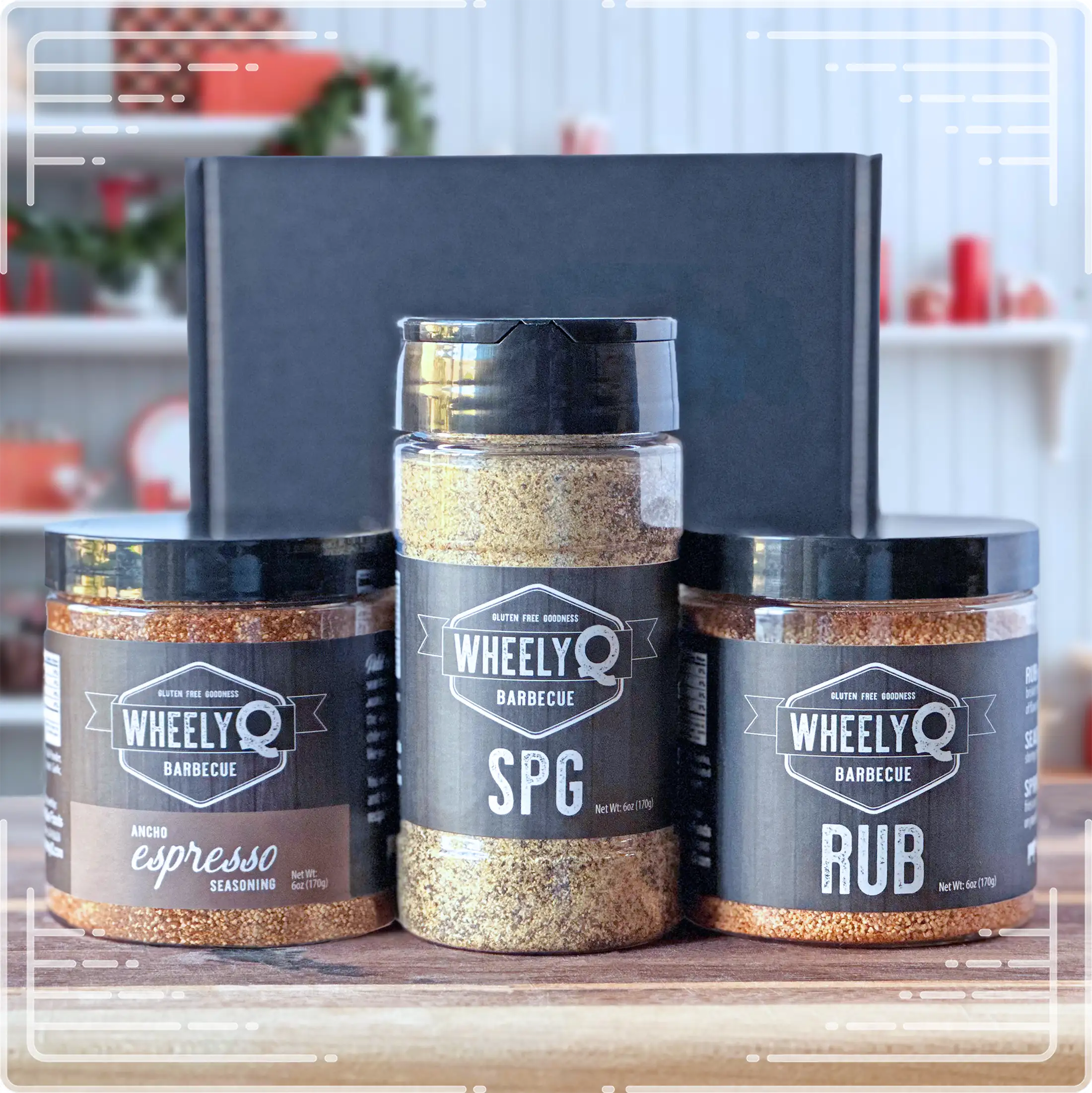 Image of our Rub and Seasoning Gift Box from WheelyQ Barbecue.  This gift set includes 1 jar of Ancho Espresso Seasoning, 1 bottle of SPG Seasoning and 1 jar of All-Purpose Rub.