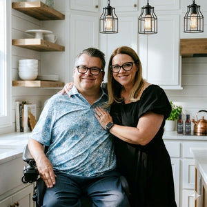 Collin and Kyla Pollock, Founder and Owners of WheelyQ Barbecue photographed in a modern farmhouse kitchen.