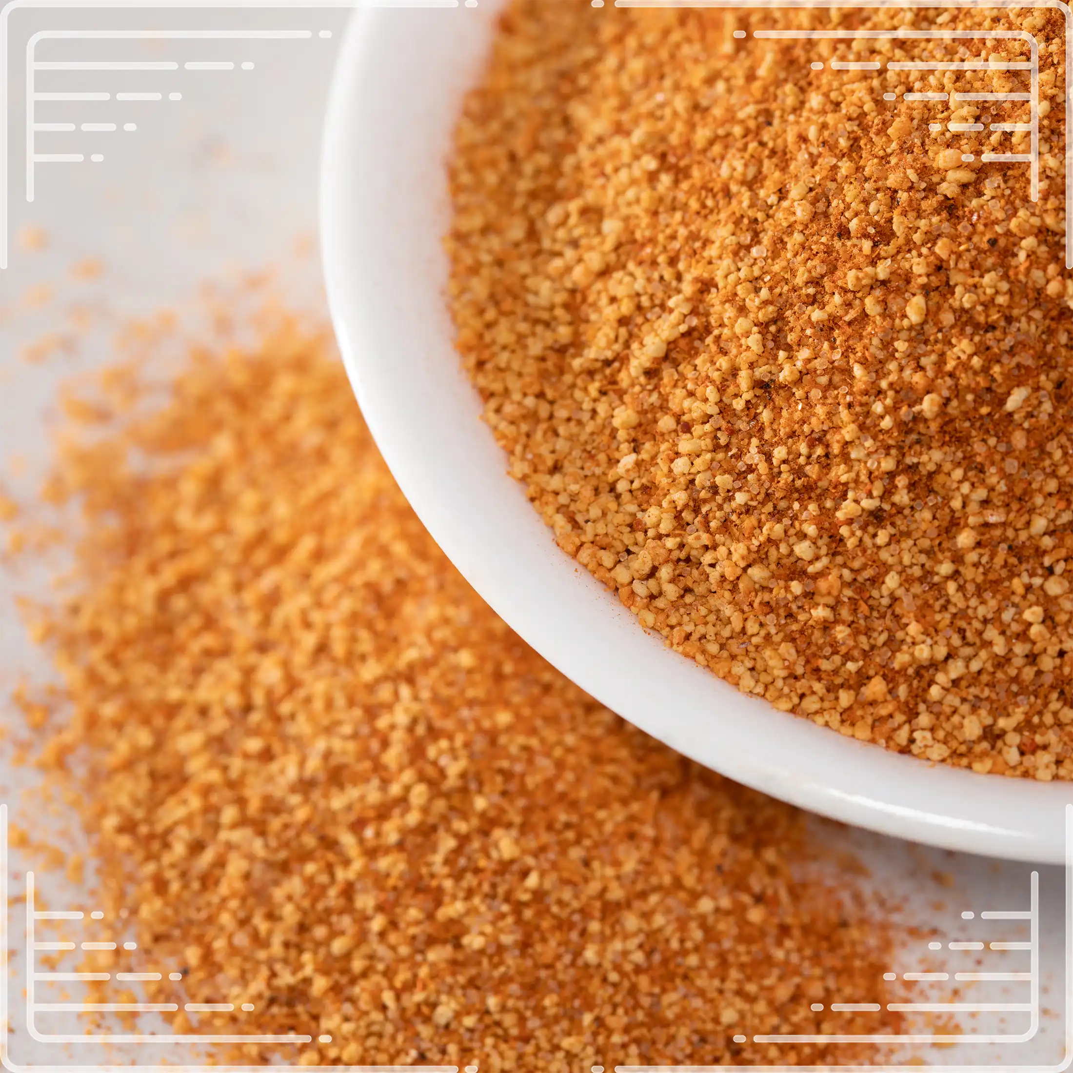 Close-up of WheelyQ Barbecue All-Purpose Barbecue Rub in a white bowl on a kitchen counter.