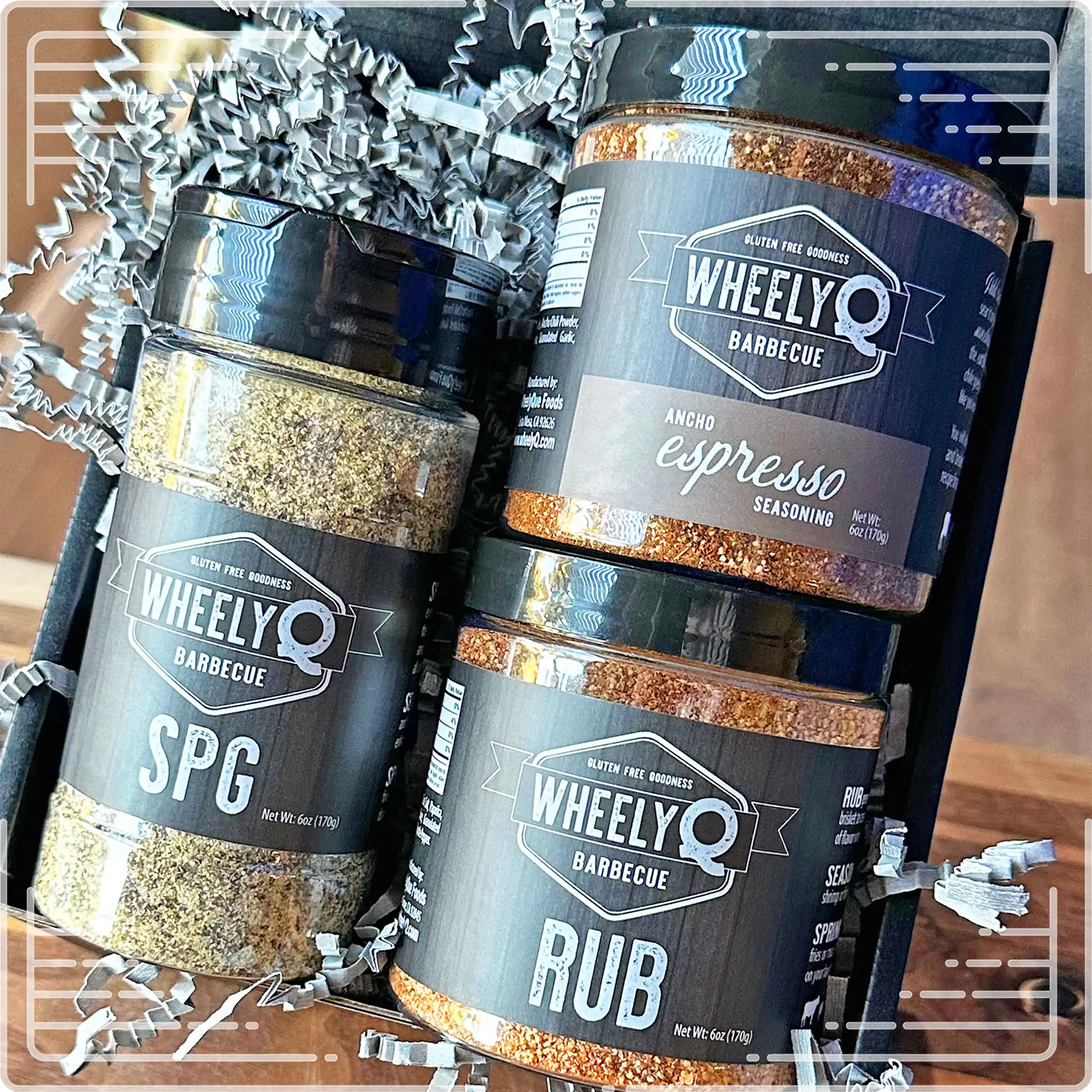 Image of our Rub and Seasoning Gift Box from WheelyQ Barbecue.  This gift set includes 1 jar of Ancho Espresso Seasoning, 1 bottle of SPG Seasoning and 1 jar of All-Purpose Rub.
