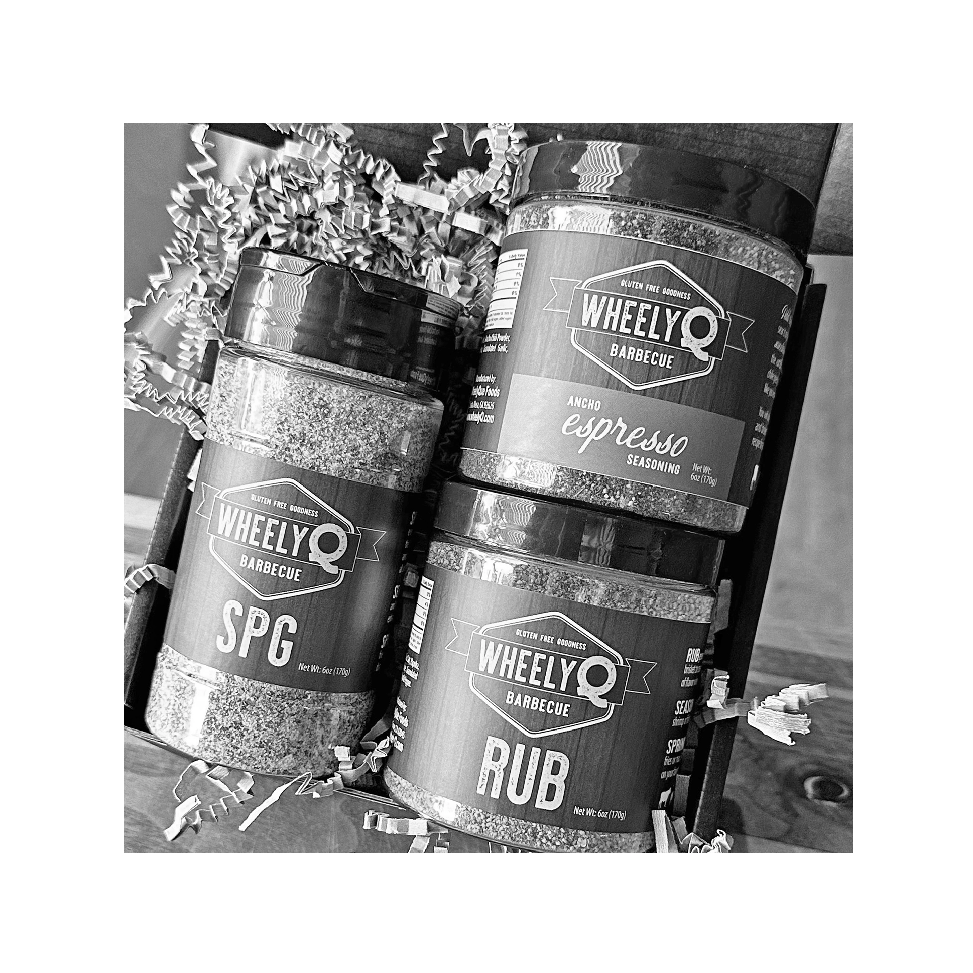 Image of our Rub and Seasoning Gift Box from WheelyQ Barbecue.  This gift set includes 1 jar of Ancho Espresso Seasoning, 1 bottle of SPG Seasoning and 1 jar of All-Purpose Rub.