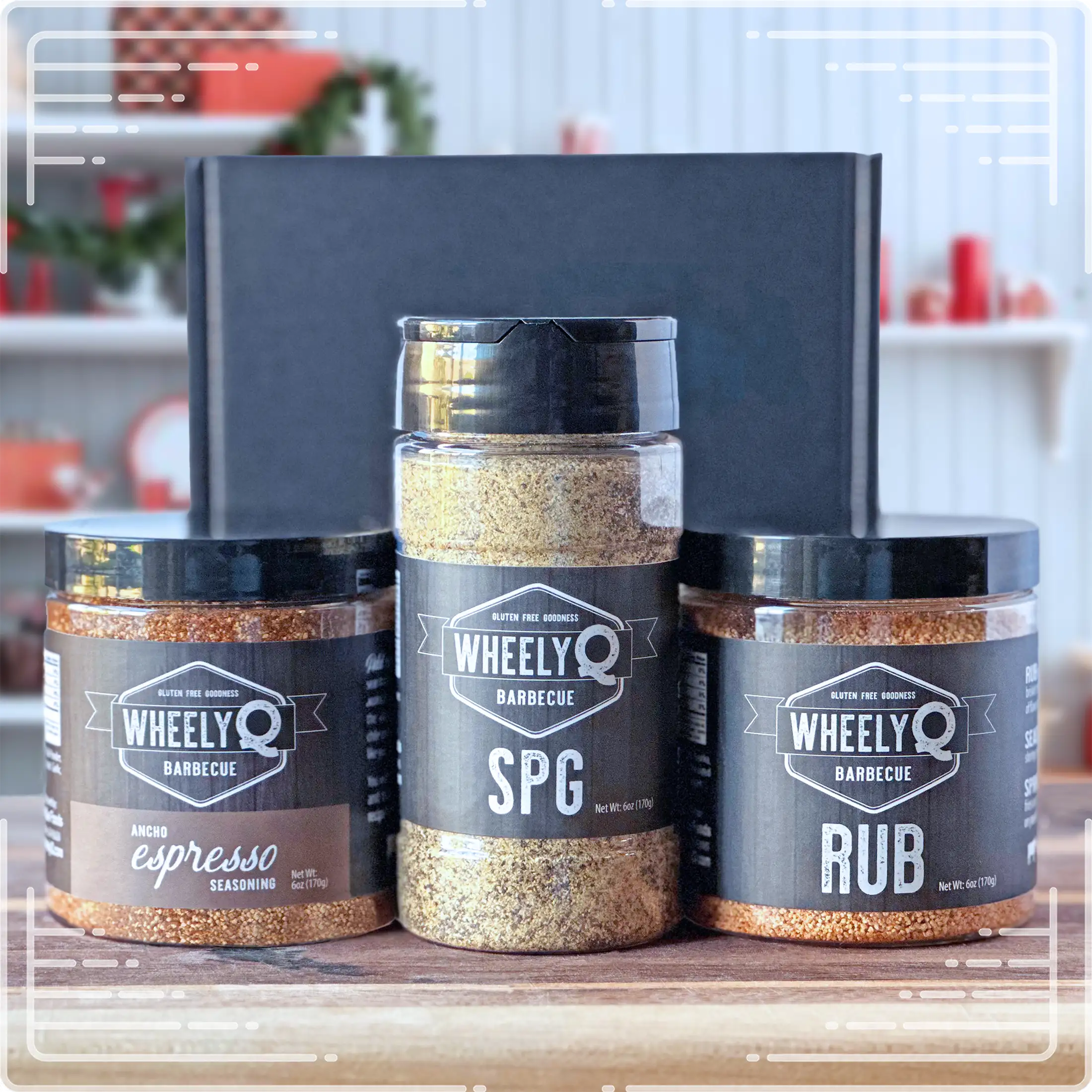 Image of our Rub and Seasoning Gift Box from WheelyQ Barbecue.  This gift set includes 1 jar of Ancho Espresso Seasoning, 1 bottle of SPG Seasoning and 1 jar of All-Purpose Rub.