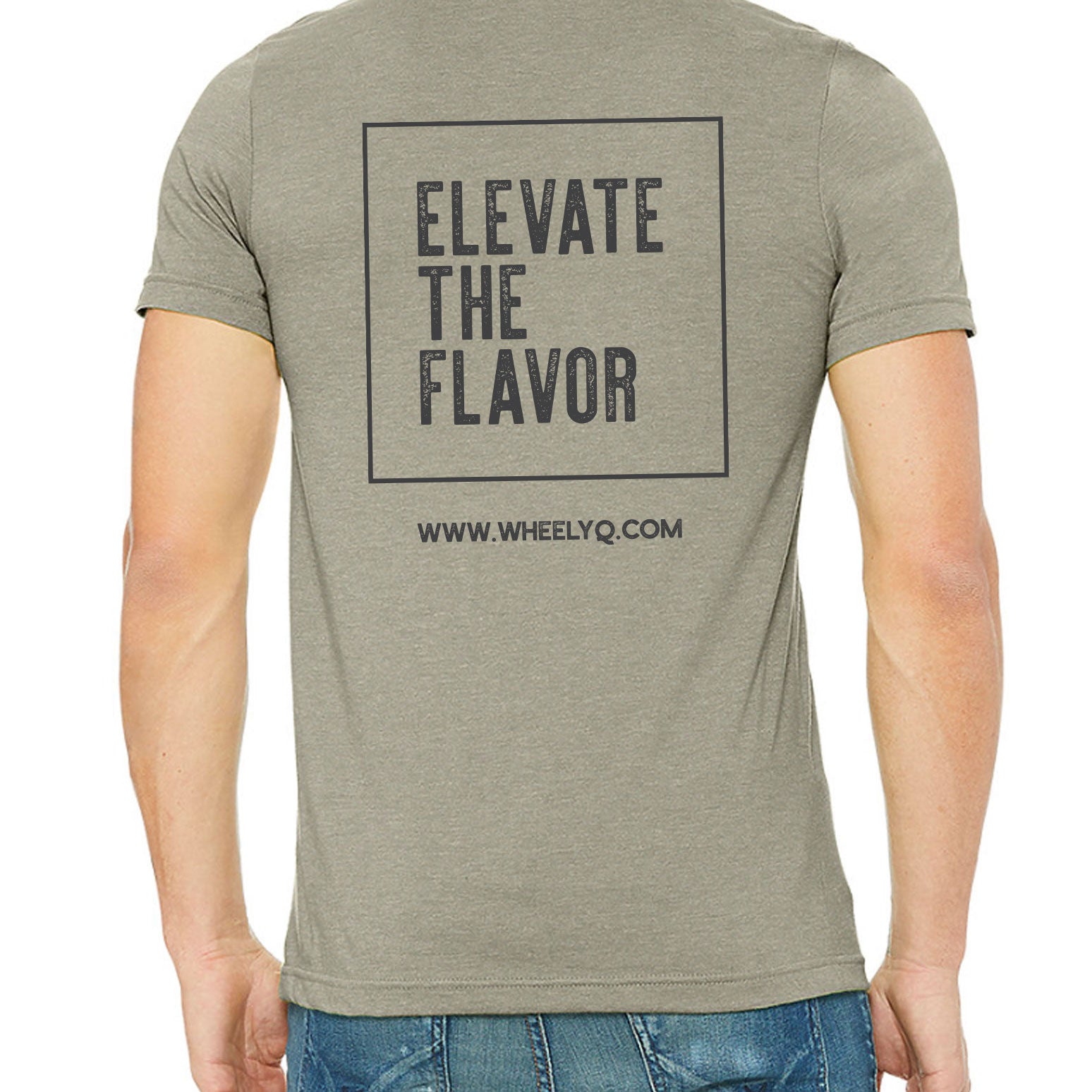 Image of a male torso that his wearing a WheelyQ Barbecue T Shirt that has the Elevate The Flavor slogan on the back.