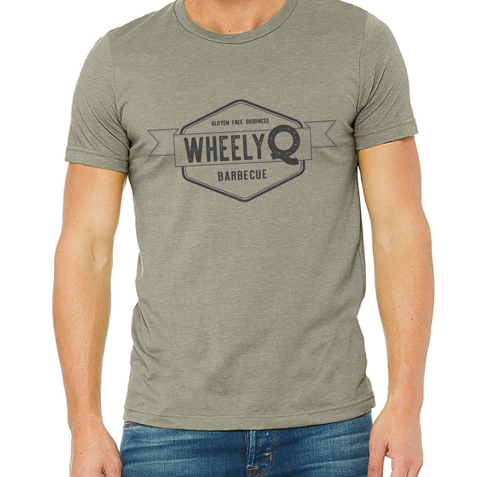 Image of a male torso that his wearing a WheelyQ Barbecue T Shirt that has the WheelyQ logo on the front.